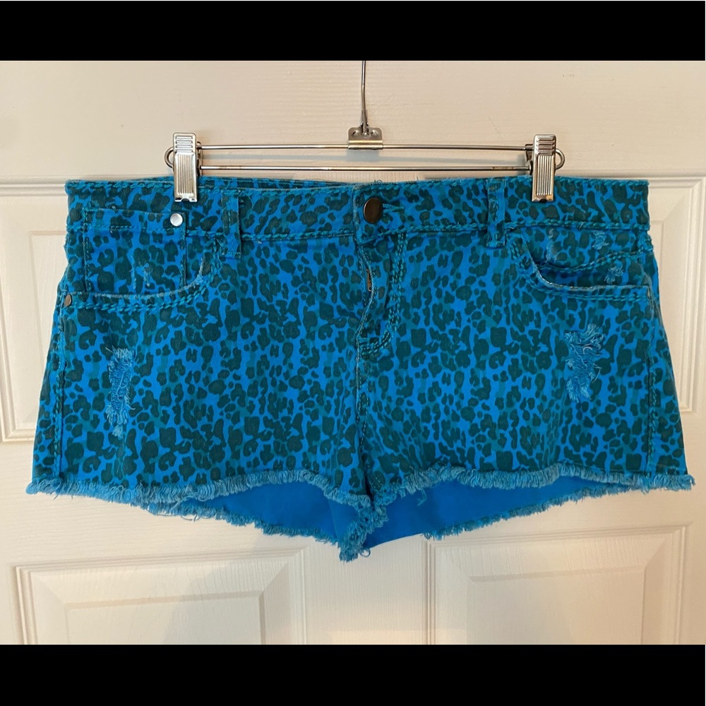 Turquoise Cheetah print fringe jean shorts